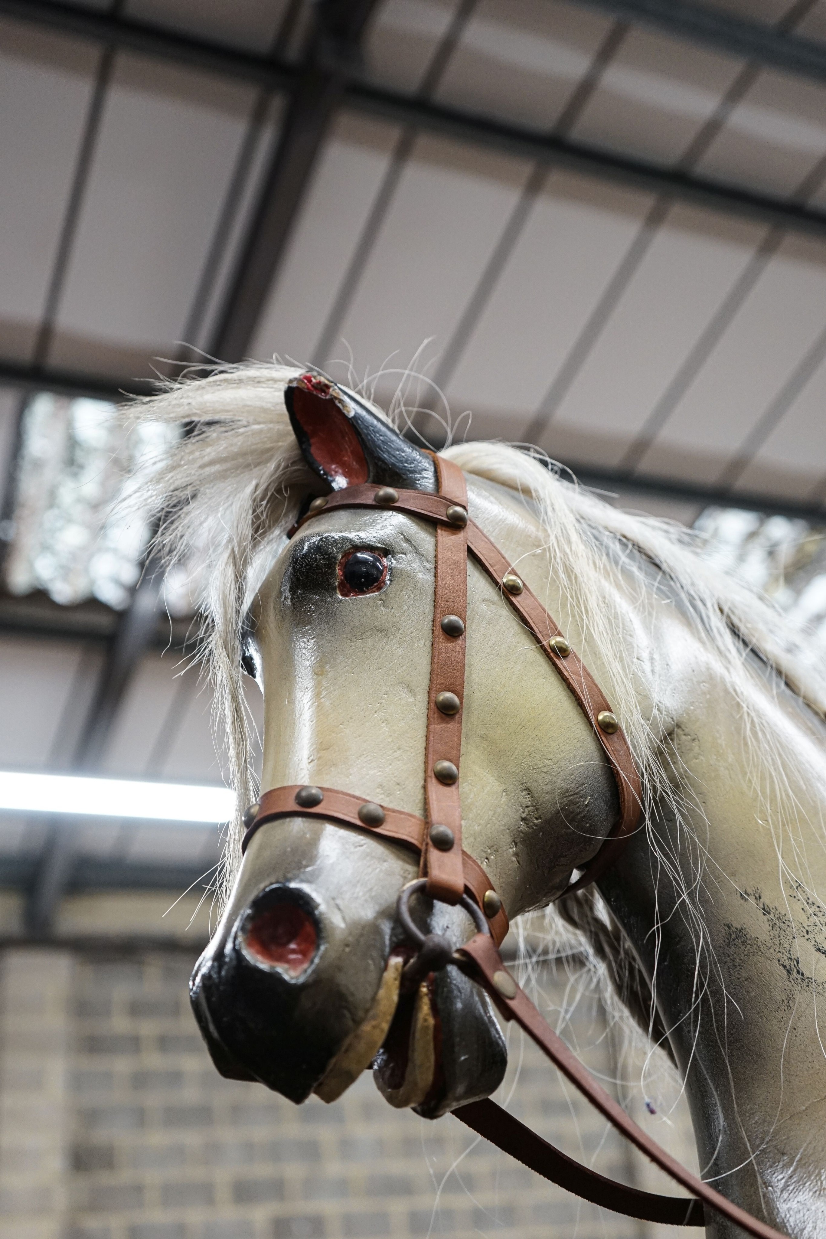 A large Victorian style painted rocking horse with end seats, length 240cm, height 132cm